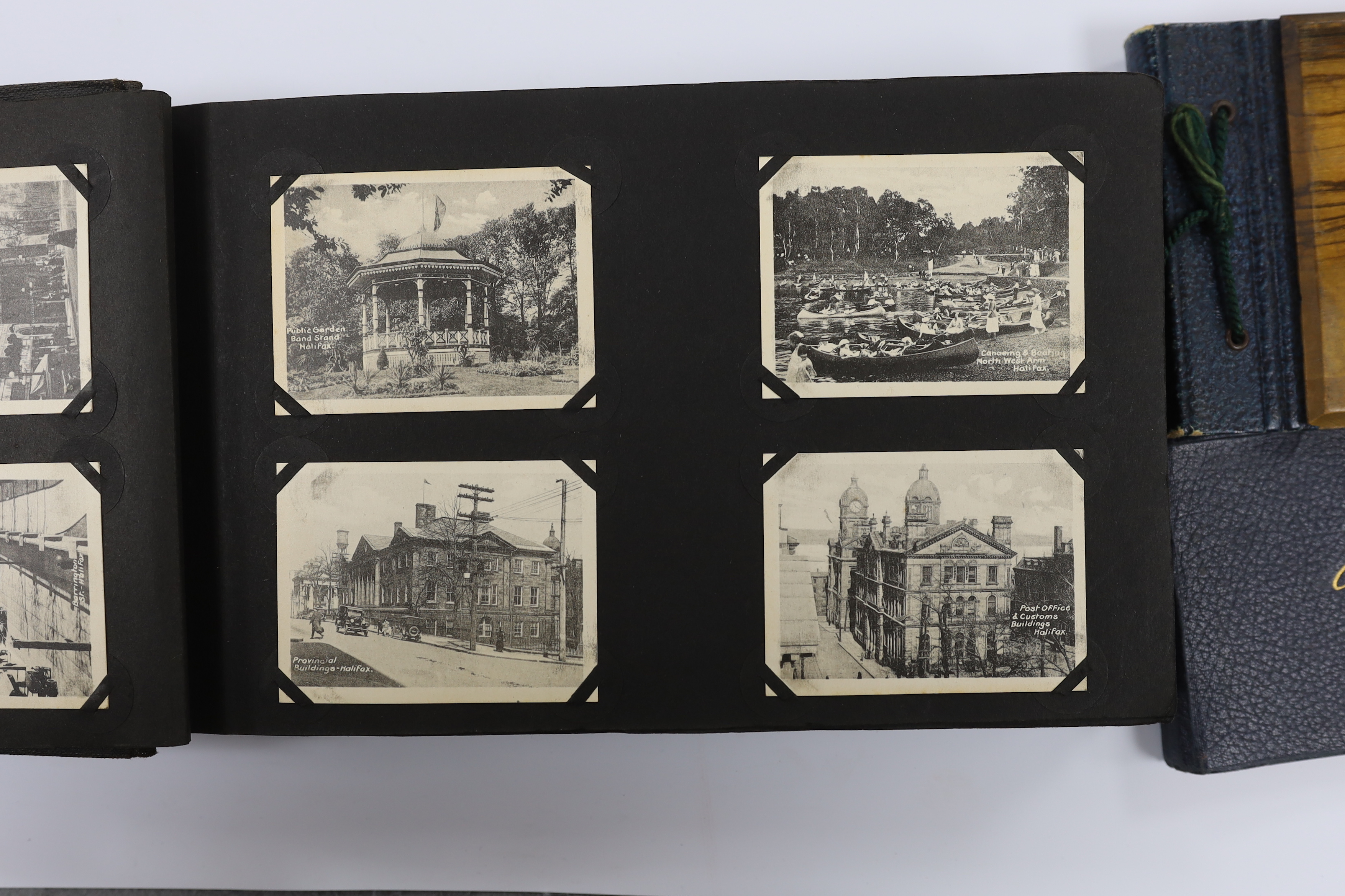 Two albums of early 20th century postcards and black and white photographs, many with naval interest, including photographs of battleships, and naval manoeuvres, during the 1930s, scenes of Bermuda, portraits of soldiers